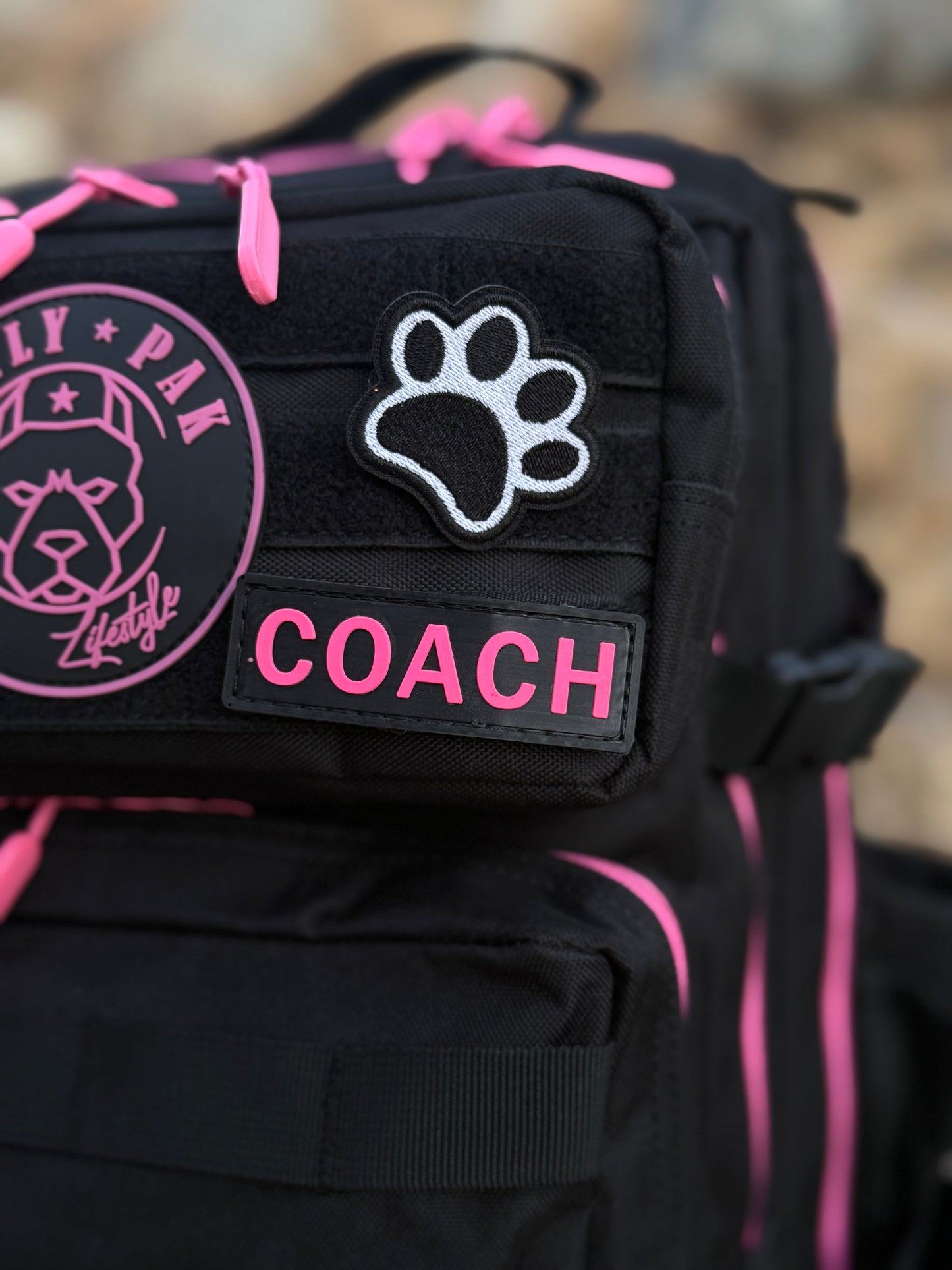 Mochila BULLYpak 45 Litros PRO. Negra cierres Fucsia