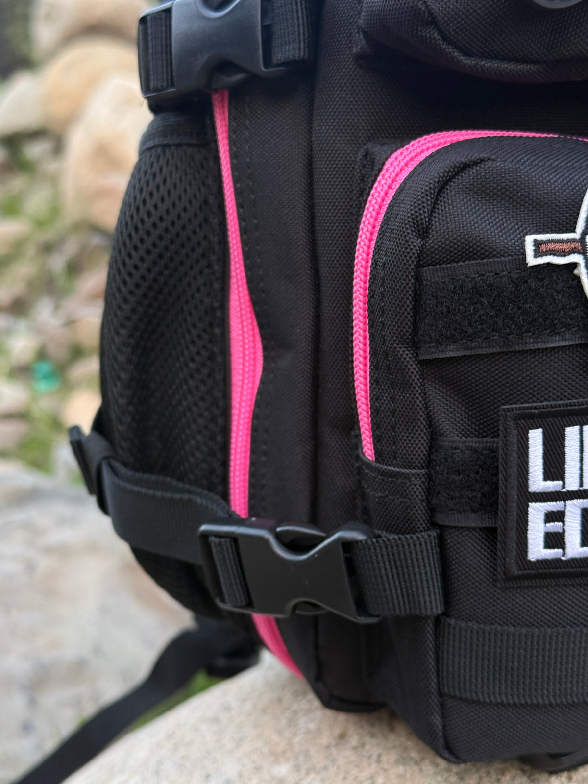 Mochila Minibully 9 Litros PRO. Negra cierres fucsia