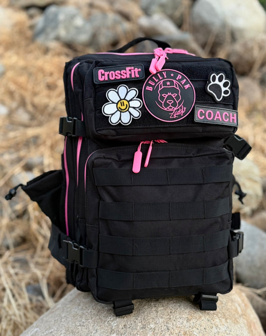 Mochila BULLYpak 25 Litros PRO. Negra cierres Fucsia