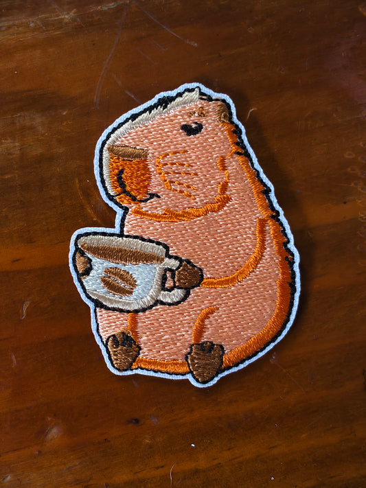 Parche Capibara tomando Cafe